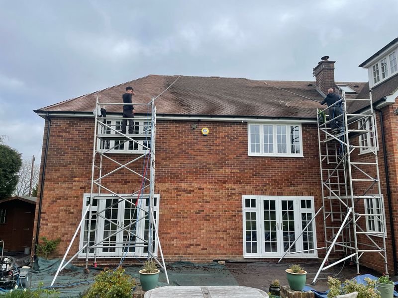 Roof cleaning carried out safely from scaffold towers by The Roof Moss Cleaners in Grove